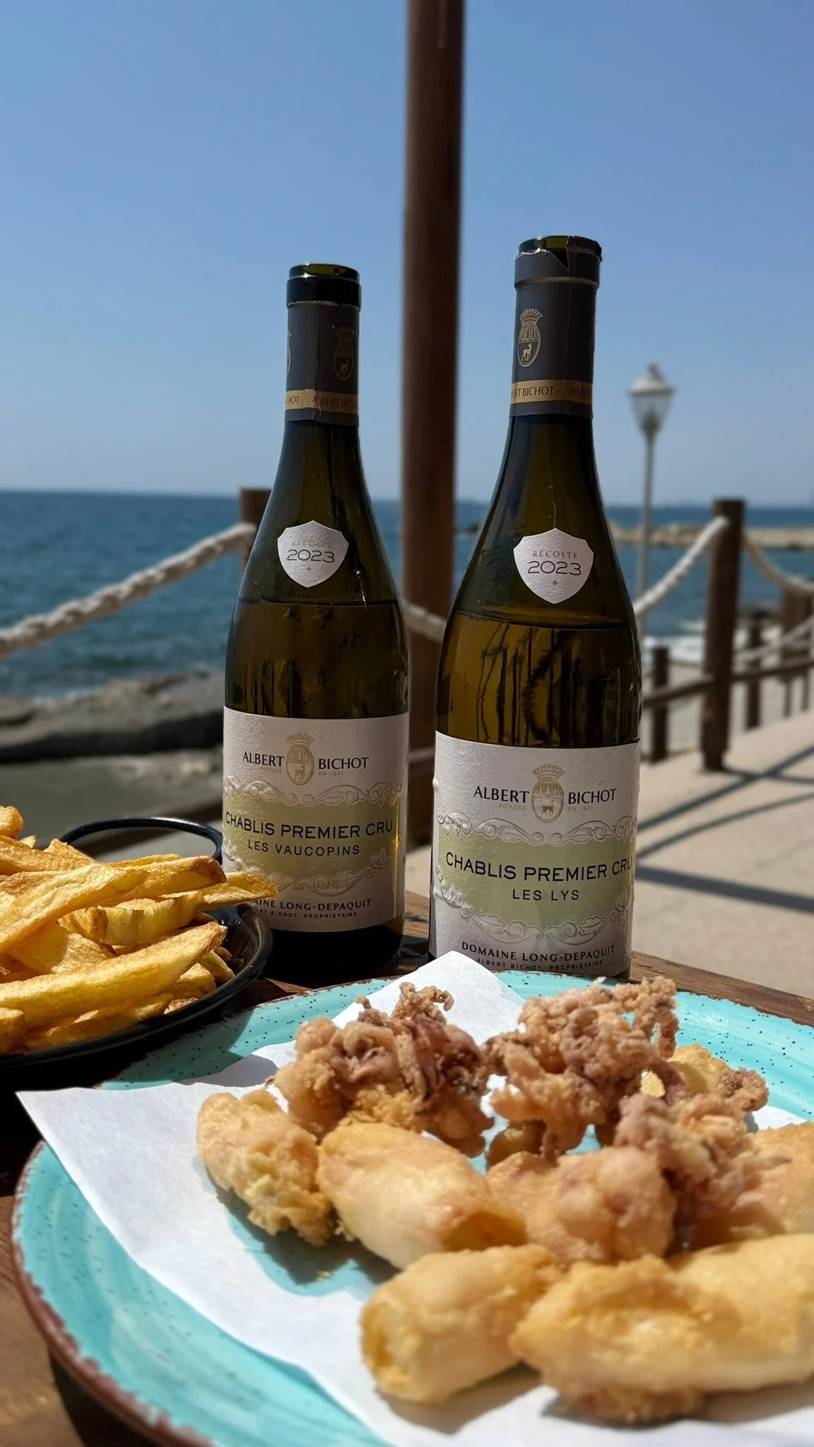 Chablis wine and grilled calamari with the Mediterranean horizon at Old Limassol